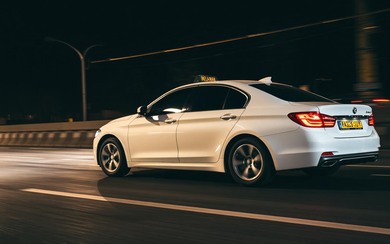 MS Car Travels premium sedan on a highway at night